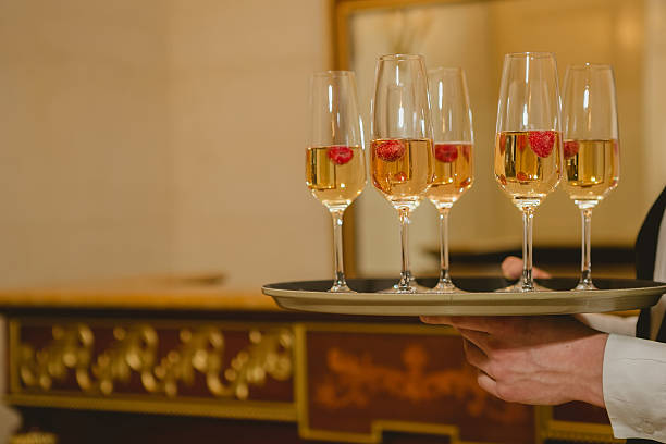 istock Waiter serving champagne on a tray 474920826