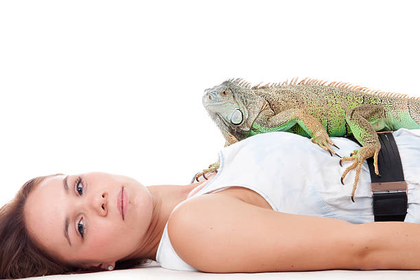 istock Girl and her iguana 474923037