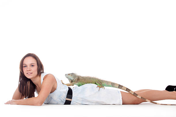 istock Girl with her iguana 474923105