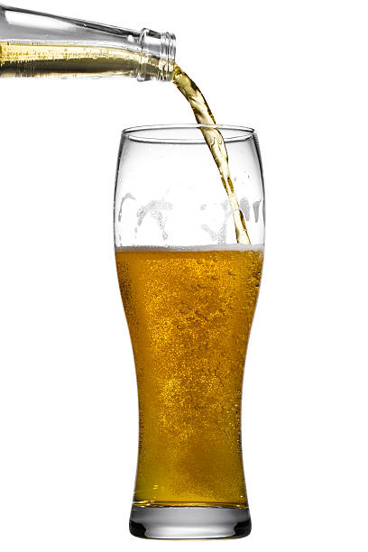 istock Beer is pouring into glass on white background 474924038