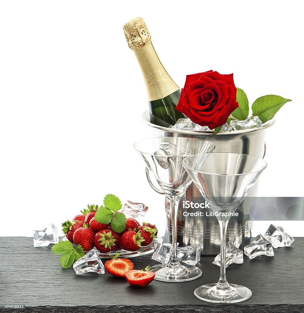 festive arrangement with champagne, red rose and strawberries festive arrangement with champagne, red rose and strawberries over white background Love - Emotion Stock Photo
