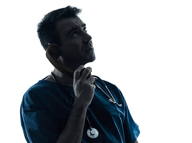 istock doctor man on the phone silhouette 474929829