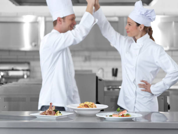 istock Chef celebrating behind the dishes 474930822