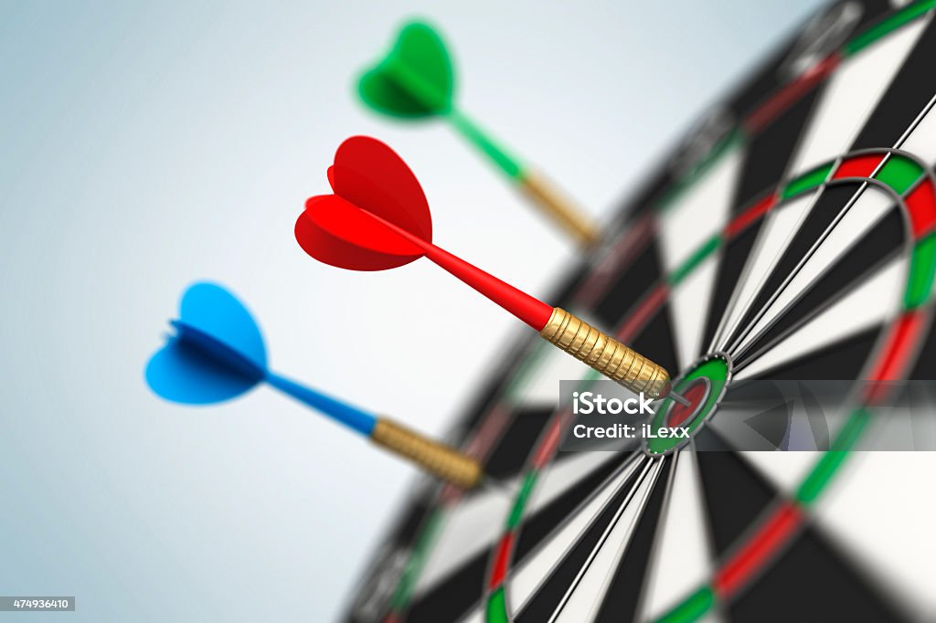 Darts arrow in bull's-eye Dart Stock Photo