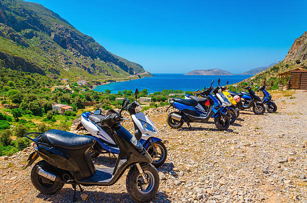 istock Scooters parked and sea bay with beach, Greece 474936756