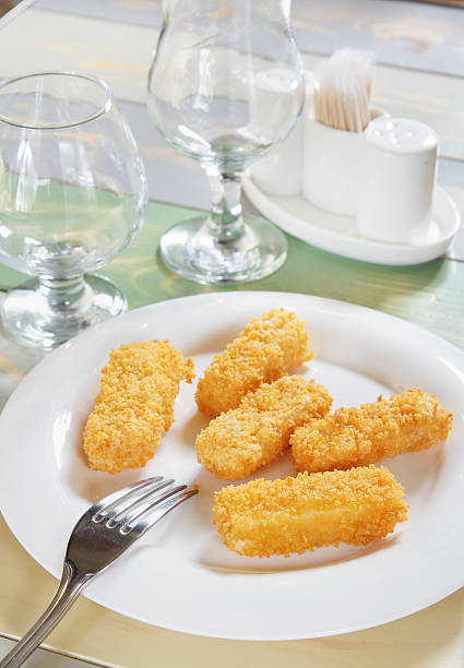 istock Pieces of cheese au gratin on a served table 474937773