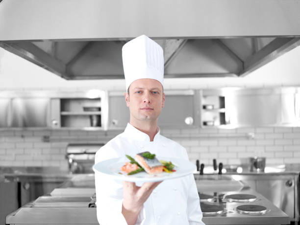 istock The chef offers a salmon dish 474938042