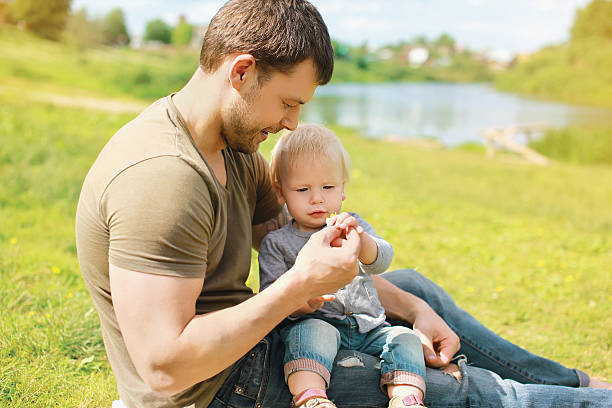 istock Father with baby together resting in summer day 474938070