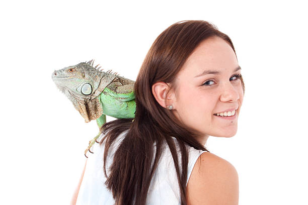 istock Girl with an iguana 474938763