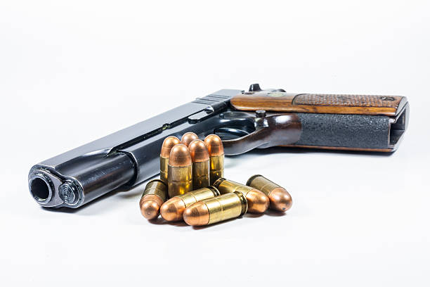 istock 11 mm. Black handgun And ammunition 474939751