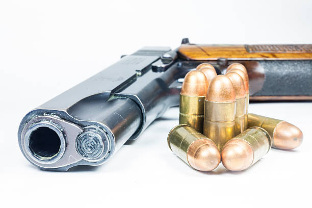 istock 11 mm. Black handgun And ammunition 474940671