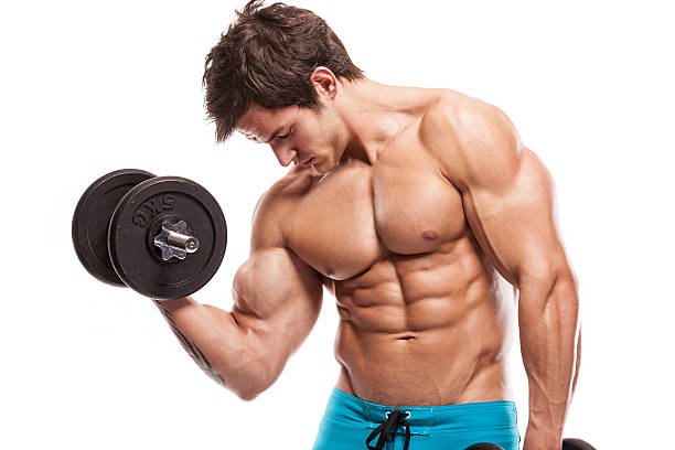 istock Muscular bodybuilder guy doing exercises with dumbbells over whi 474941901