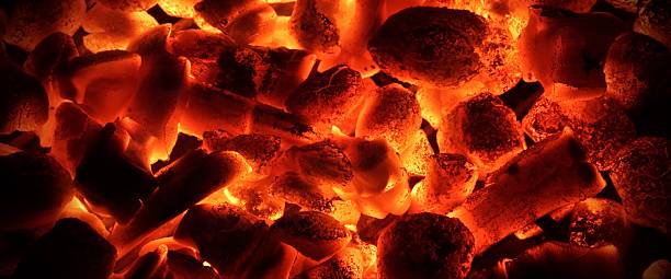 istock Glowing Charcoal Briquettes  Background Texture 474944780