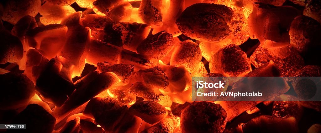 Glowing Charcoal Briquettes  Background Texture Glowing Charcoal Briquettes In The BBQ Grill Pit Background Texture Close-up 2015 Stock Photo