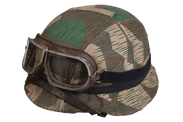istock camouflaged nazi german helmet with protective goggles 474945250