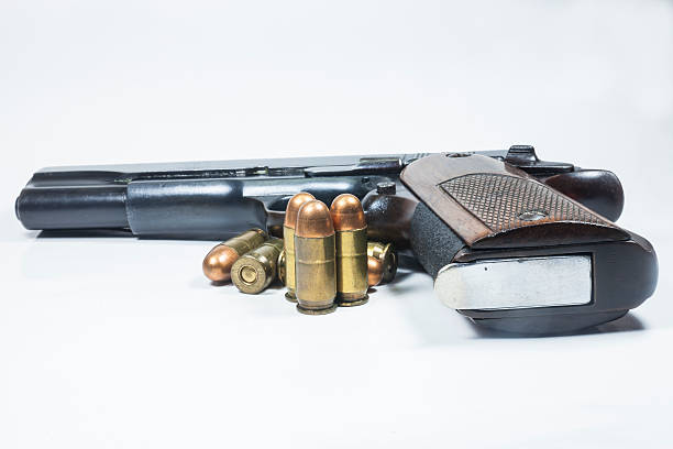 istock 11 mm. Black handgun And ammunition 474948857