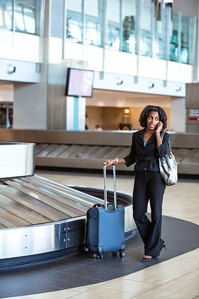 istock Waiting for her luggage in airport 474948869