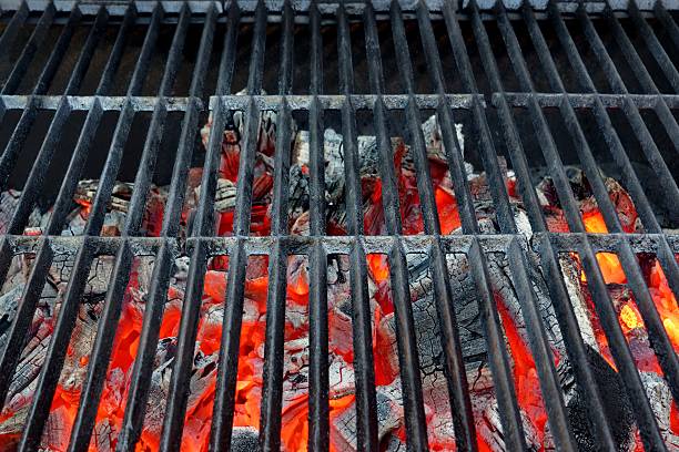 Emty Hot Barbecue Grill With Glowing Charcoal Background