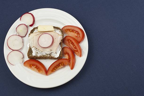 istock cheerful diet breakfast, wholemeal bread with ham and radish 474949528
