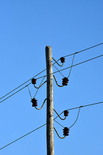 istock wooden pylon with wires 474950532