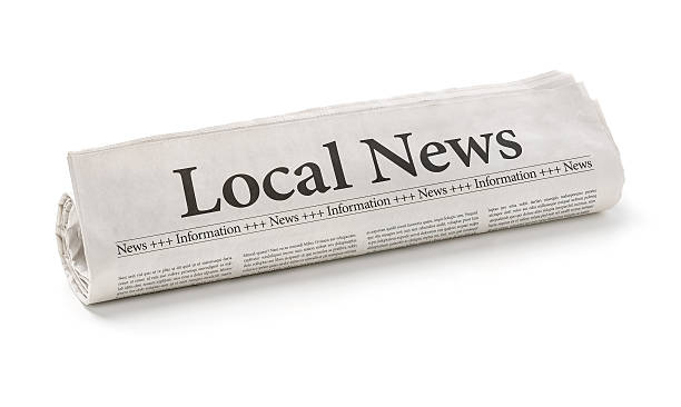 Rolled newspaper with the headline Local News