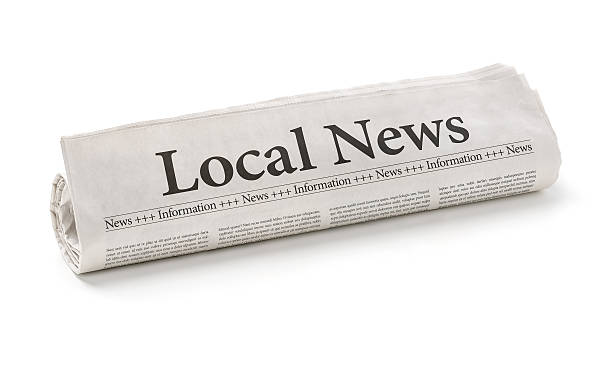 Rolled newspaper with the headline Local News Rolled newspaper with the headline Local News experiential travel stock pictures, royalty-free photos & images