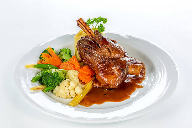 istock Baked lamb meat with vegetables 474952574