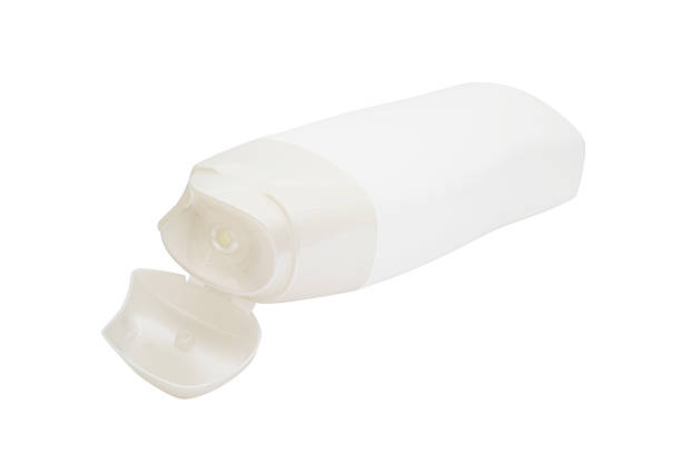 istock white  plastic  cosmetic bottle with opened lid 474952668