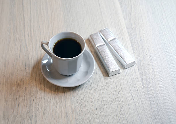 istock cup of coffee and two chocolates 474957058