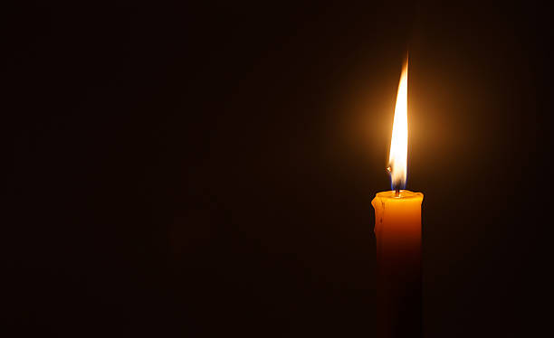 istock Candle light in darkness  as light for life 474957894
