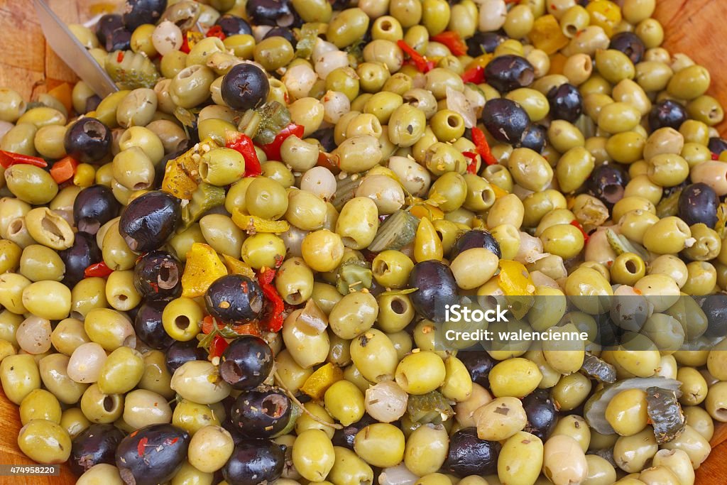 Yellow and black olives salad Background with yellow and black olives salad 2015 Stock Photo