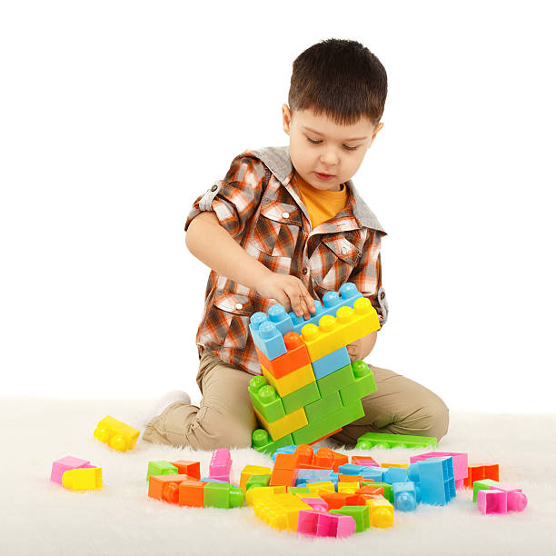 istock Little boy playing with designer on the floor 474958374