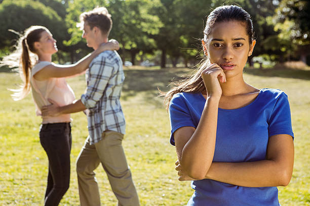 istock Man being unfaithful in the park 474959390