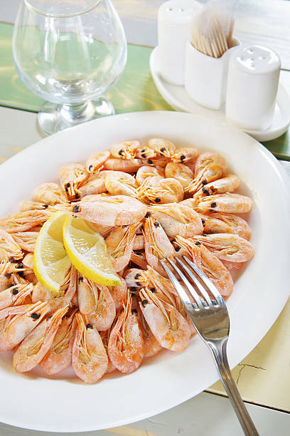 istock Cooked shrimps in a large plate on the table 474960037