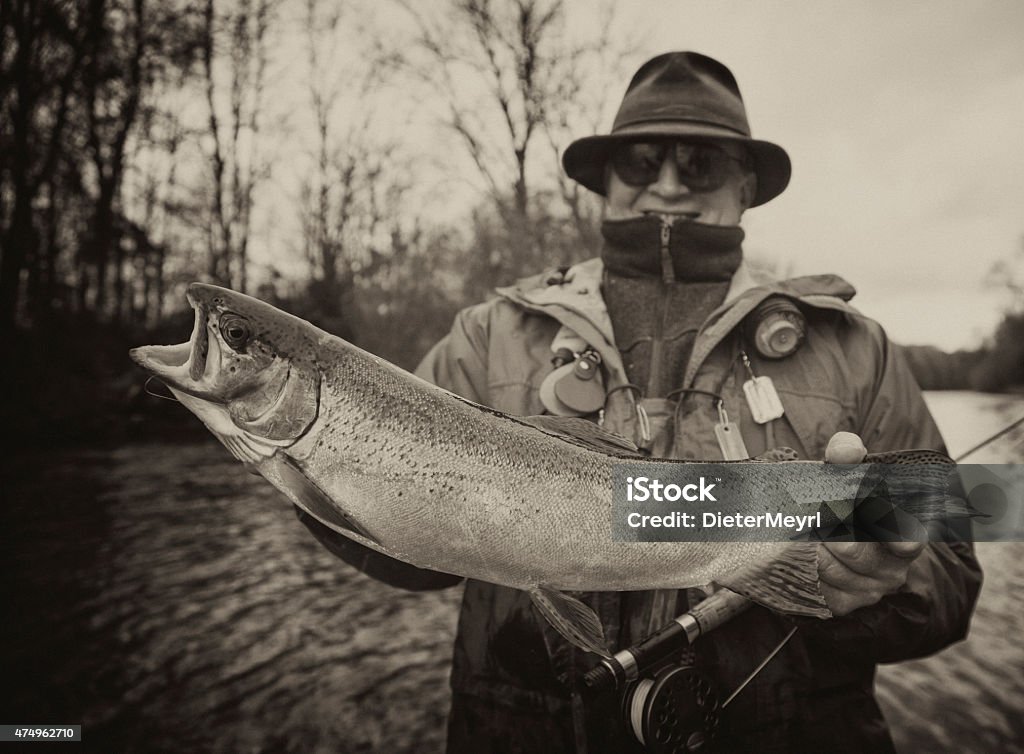 https://media.istockphoto.com/id/474962710/photo/vintage-flyfishing-old-flyfisher-with-trout.jpg?s=1024x1024&w=is&k=20&c=gDIZThmNic49Uv6daZzgABcn4RHG3rKPCWQr52hkbO8=