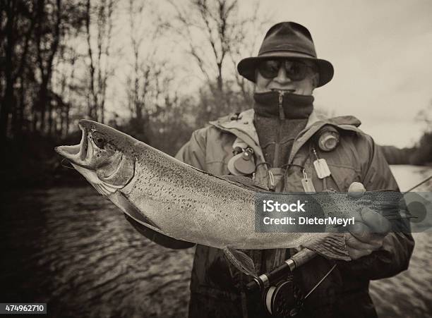 Vintage Flyfishing Old Flyfisher With Trout Stock Photo - Download Image Now - Retro Style, Old-fashioned, Fishing