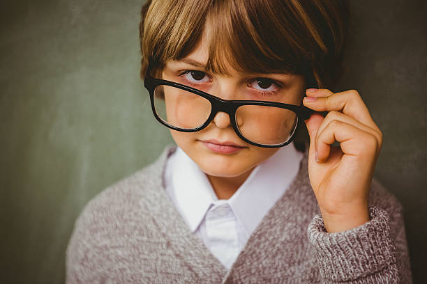 istock Cute little boy holding glasses 474962756
