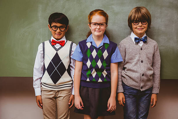istock Smiling little school kids in classroom 474963016