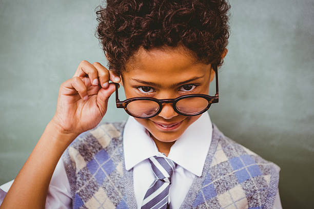 istock Cute little boy holding glasses 474963180