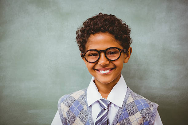 istock Cute little boy smiling in classroom 474963208