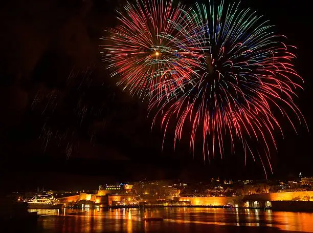 Photo of Fireworks. Colorful fireworks with Valletta background,Malta fireworks festival