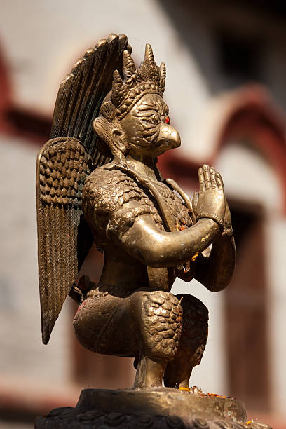 Small religious statue in the Budhanilkantha Temple, dedicated to the sleeping Hindu god Vishnu, in the Shivapuri National Park just outside of Kathmandu.