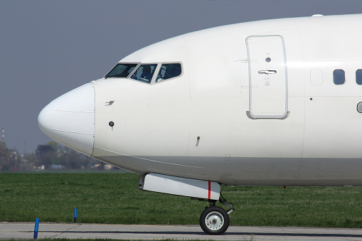 Detail of nose white plane during taxi for take off