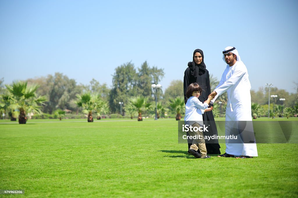 Arab family enjoying their leisure time in park Arab family enjoying their leisure time in park. 2015 Stock Photo
