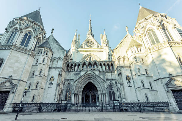 London Royal Courts of Justice View of the main facade of The Royal Courts of Justice in London in the afternoon. royal courts of justice stock pictures, royalty-free photos & images