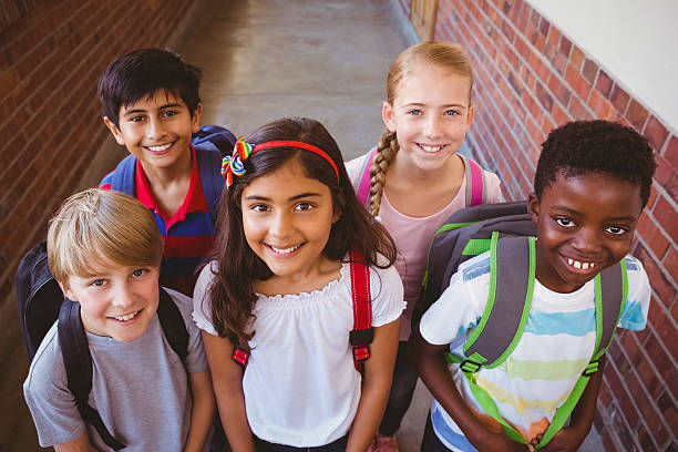 istock Little school kids in corridor 474965778