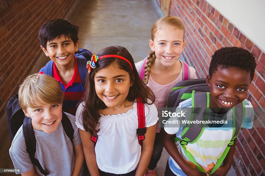 Little school kids in corridor Portrait of smiling little school kids in school corridor Elementary Student Stock Photo