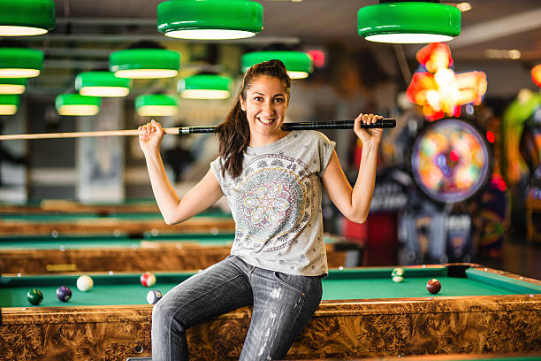 istock Happiness gill standing in a pub at the pool table 474966092