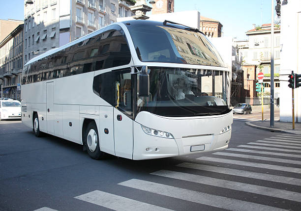 istock White Bus on a Street 474966742