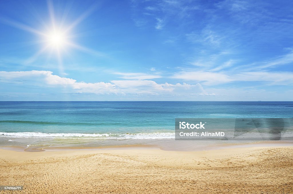 seascape and sun on blue sky seascape and sun on blue sky background Beach Stock Photo